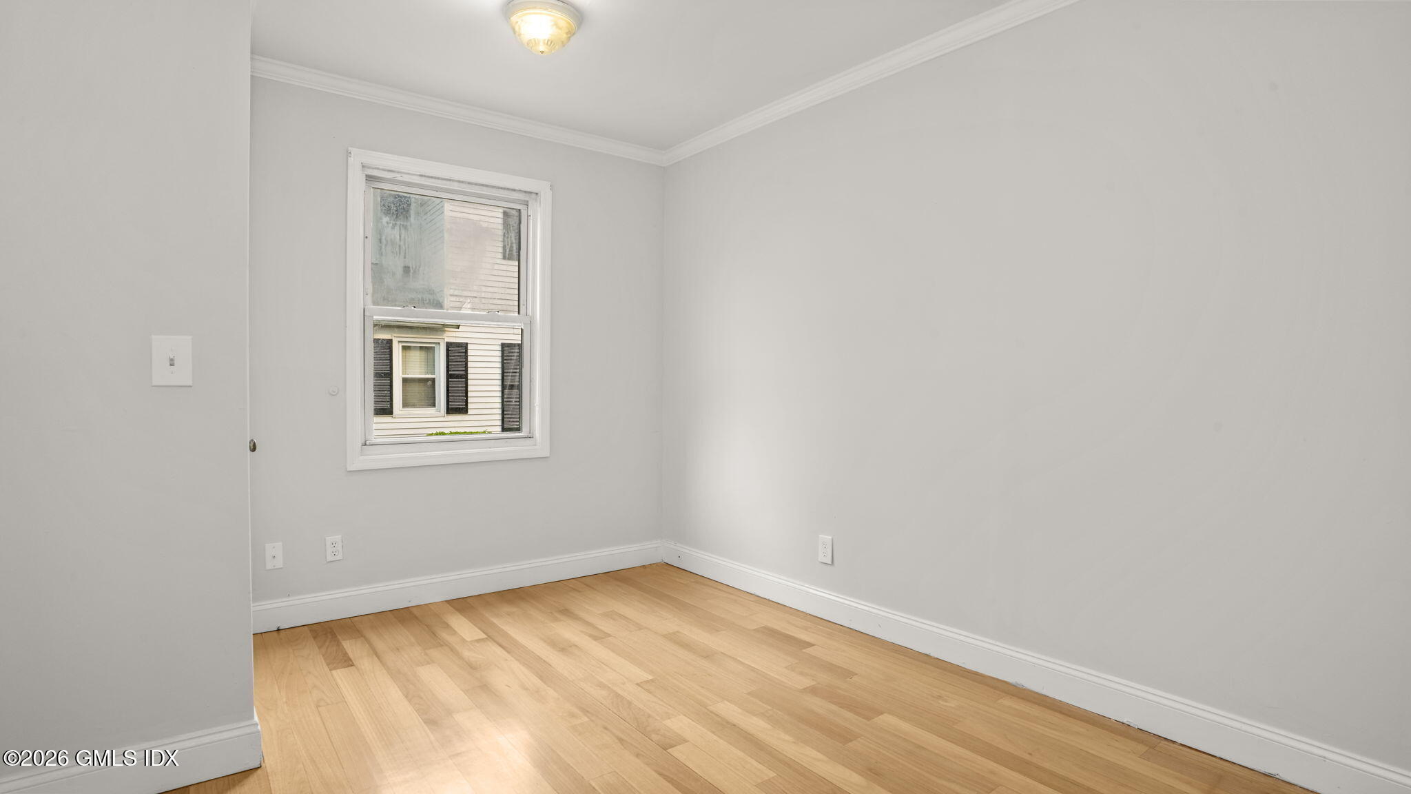 43 Church Street, Unit 1 Greenwich, CT 06830 - Photo 13 of 17 an empty room with a window