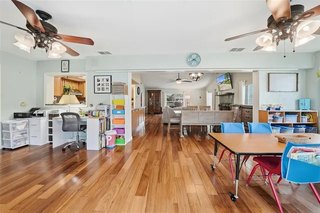 an aerial view of river residential houses with outdoor space and swimming pool