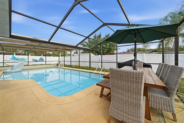 a view of a swimming pool and an outdoor space