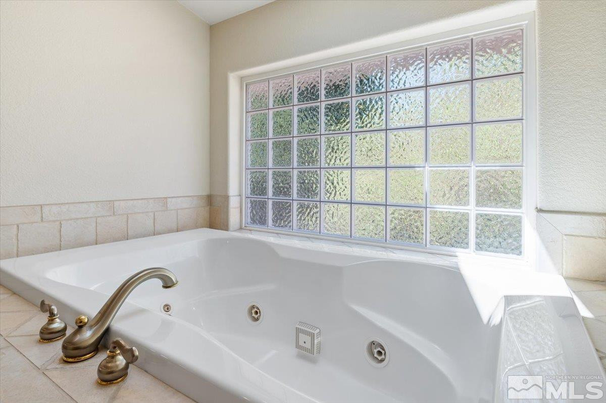 14535 South Quiet Reno, NV 89511 - Photo 24 of 40 a bath tub sitting next to a window