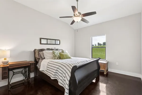 a bedroom with a bed and a table in it