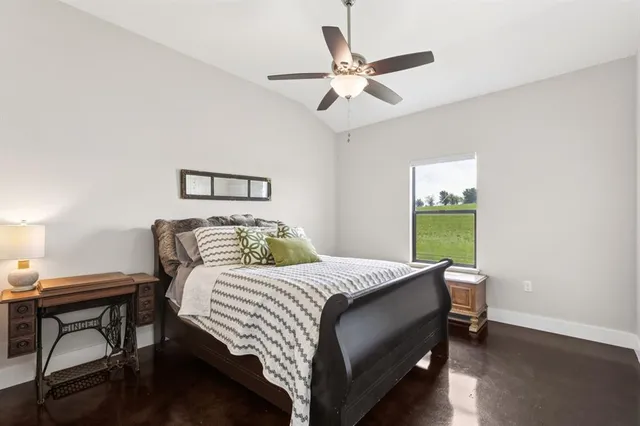 a bedroom with a bed and a table in it