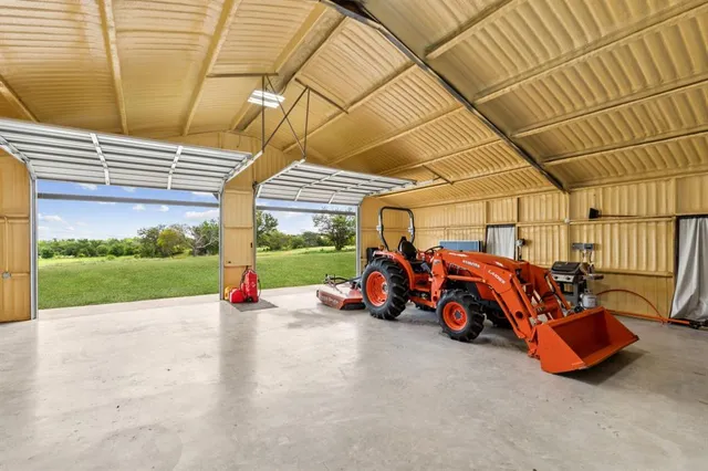 a view of a garage with parked cars
