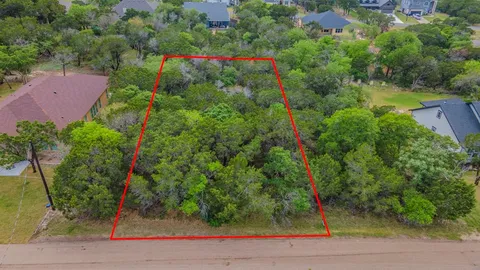 an aerial view of a houses with yard