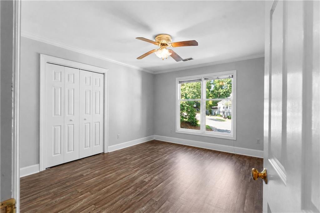 24 Commerce Row Northeast Cartersville, GA 30121 - Photo 24 of 37 wooden floor in an empty room with a window