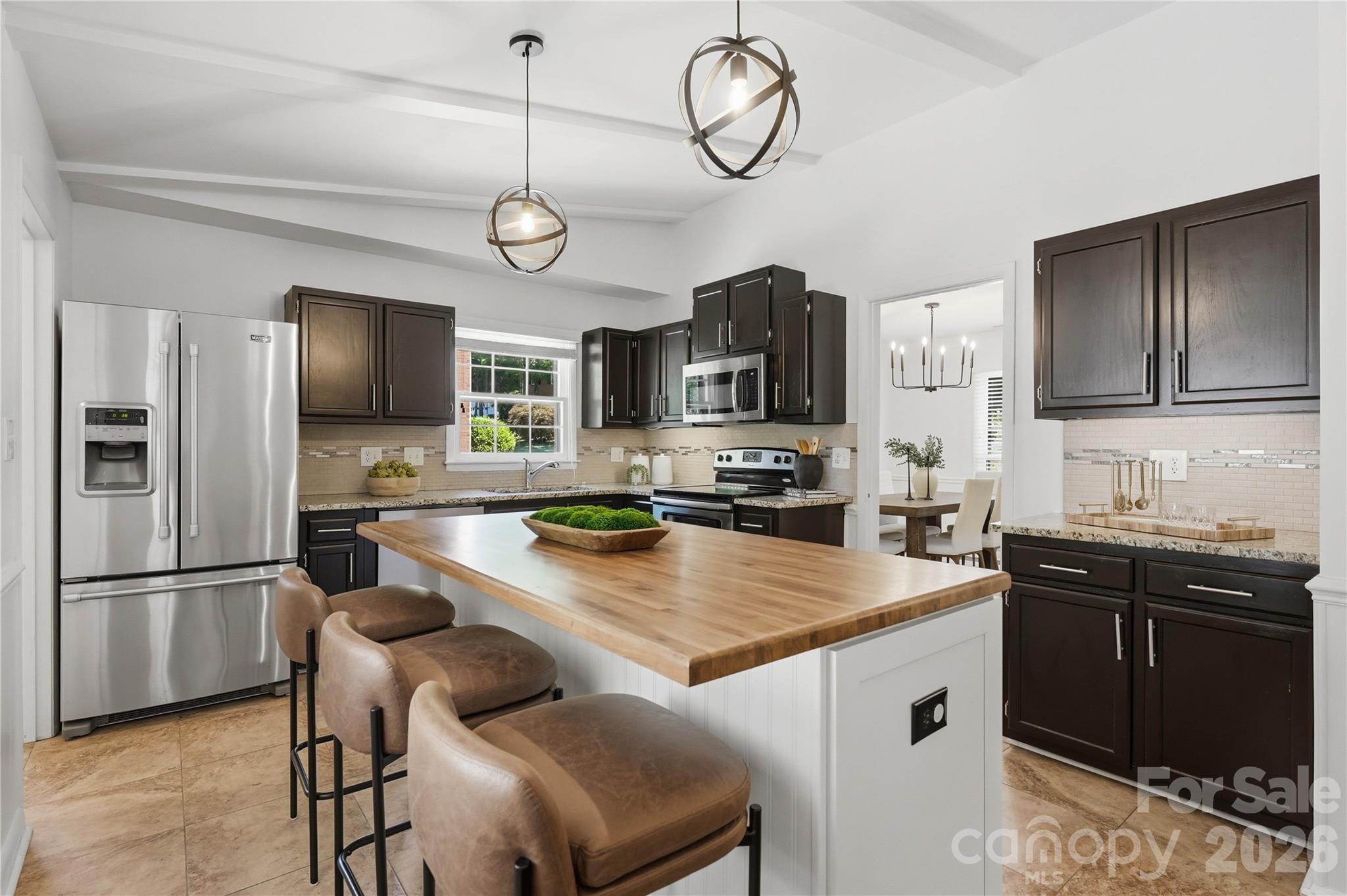 341 Neill Ridge Road Matthews, NC 28105 - Photo 15 of 36 a kitchen with cabinets a counter space stainless steel appliances and cabinets