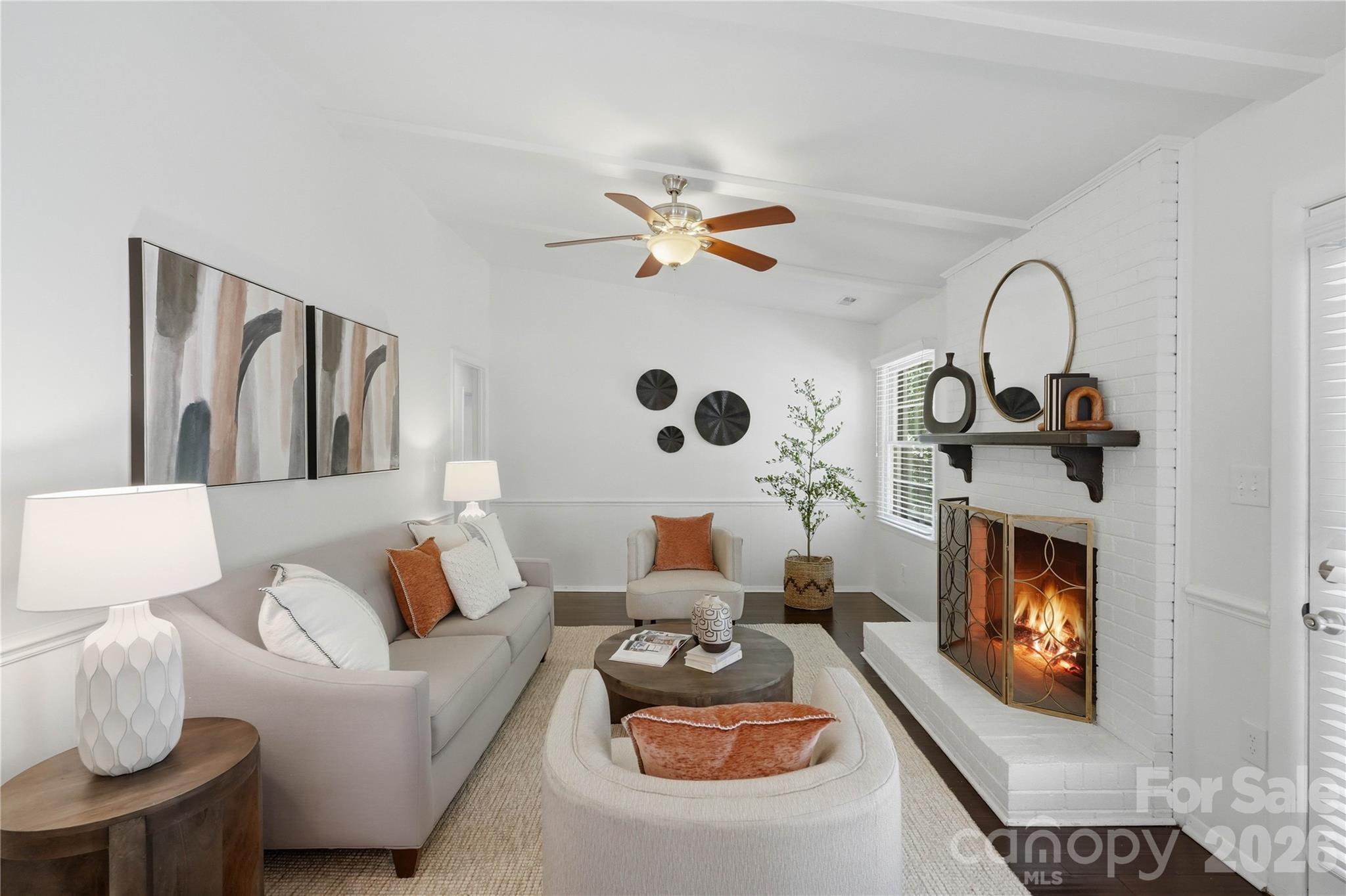 341 Neill Ridge Road Matthews, NC 28105 - Photo 20 of 36 a living room with furniture chandelier and a fireplace