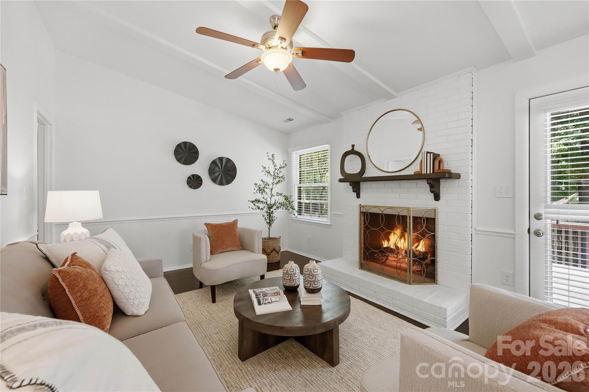 341 Neill Ridge Road Matthews, NC 28105 - Photo 22 of 36 a living room with furniture and a fireplace