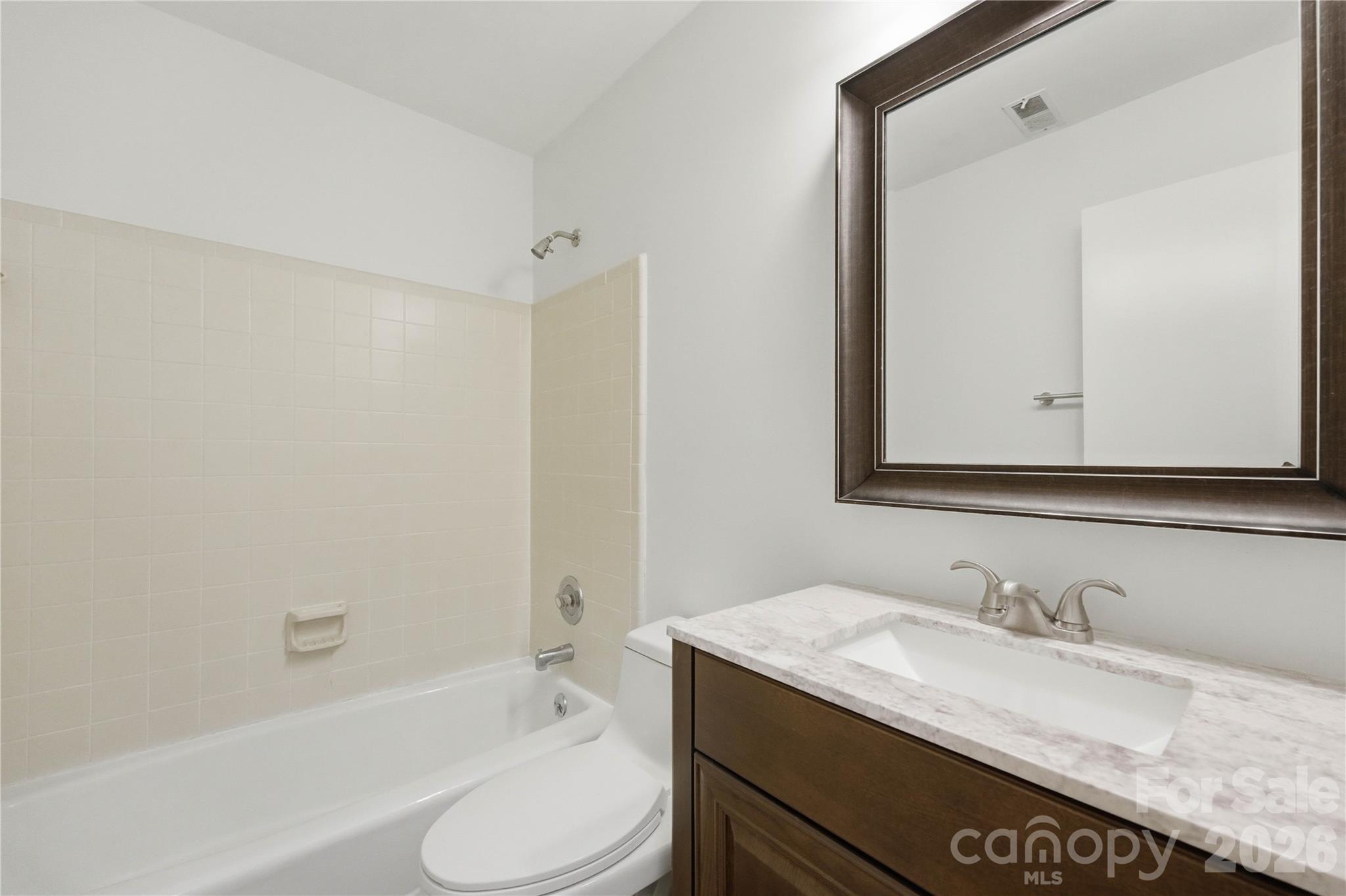 341 Neill Ridge Road Matthews, NC 28105 - Photo 25 of 36 a bathroom with a granite countertop sink toilet and shower