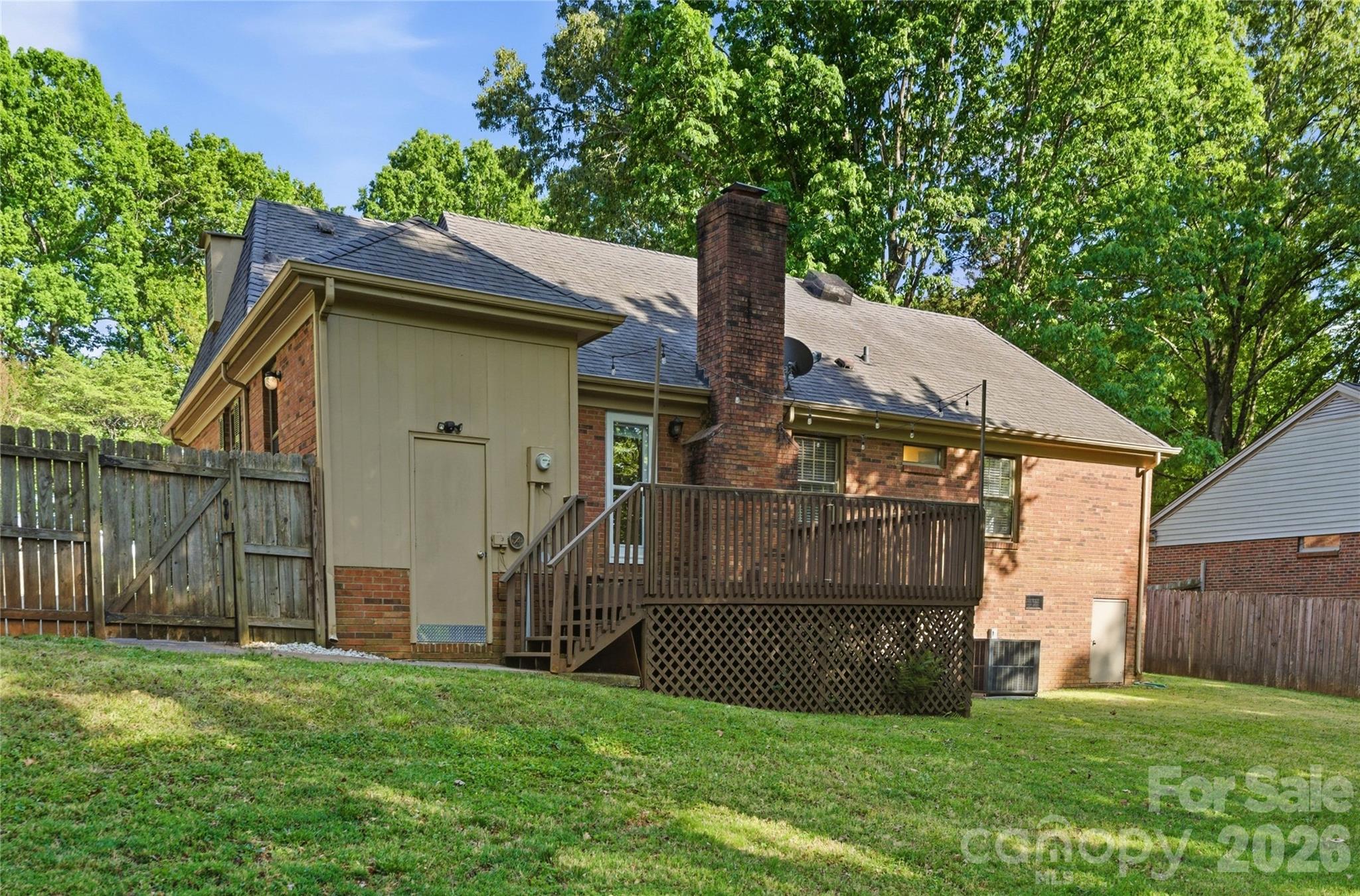 341 Neill Ridge Road Matthews, NC 28105 - Photo 33 of 36 a view of a house with a yard