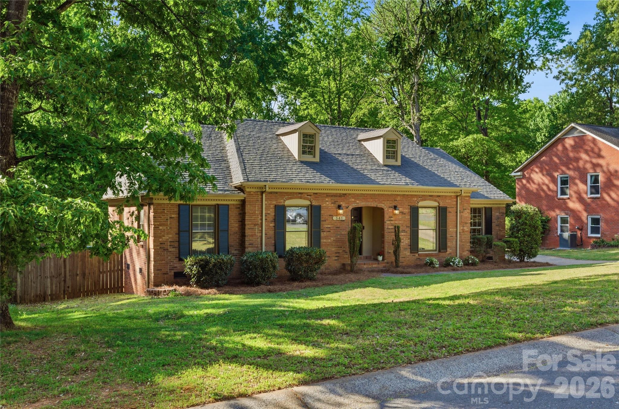 341 Neill Ridge Road Matthews, NC 28105 - Photo 4 of 36 a front view of a house with garden