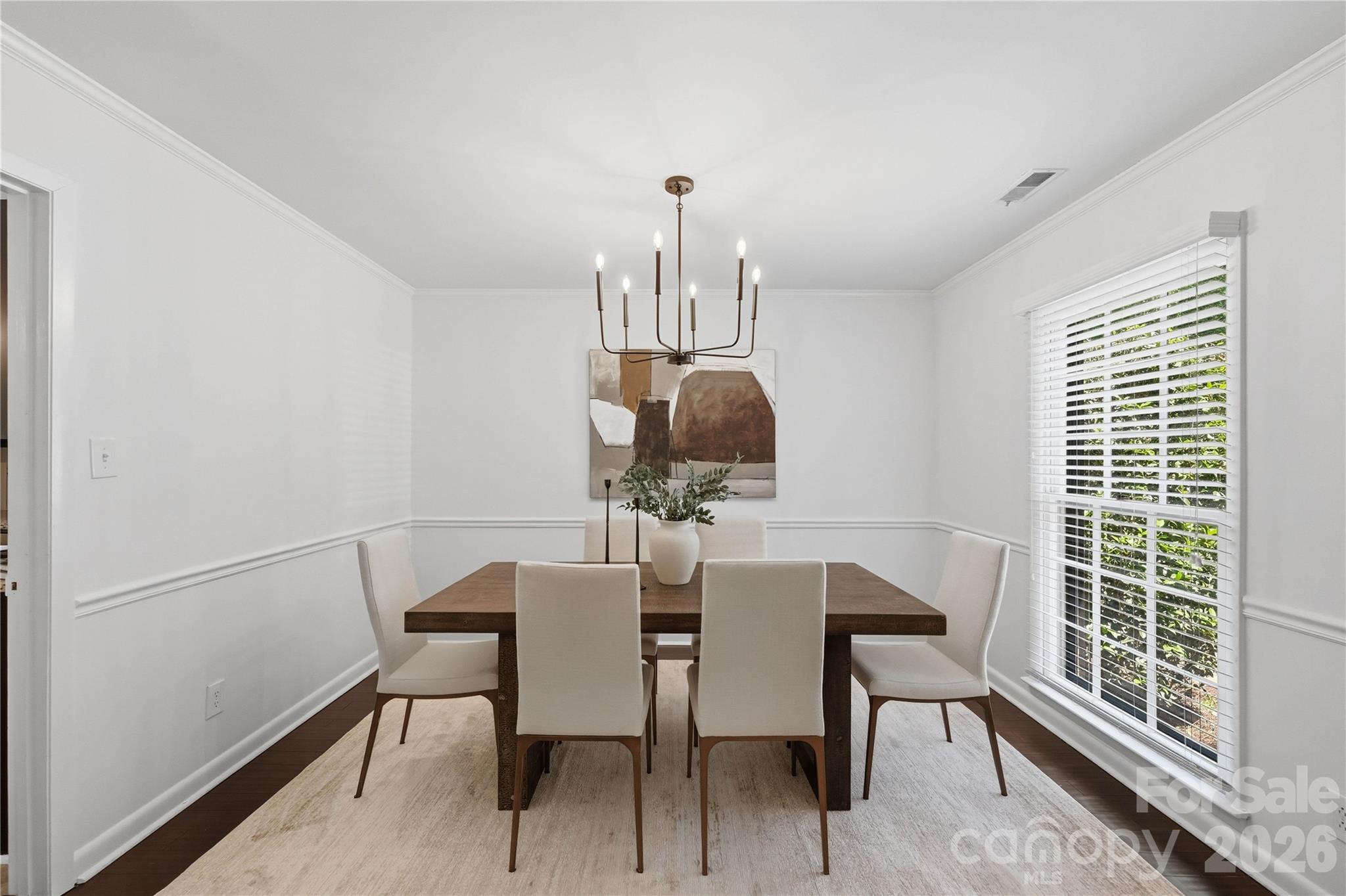 341 Neill Ridge Road Matthews, NC 28105 - Photo 9 of 36 a dining room with furniture a chandelier and wooden floor