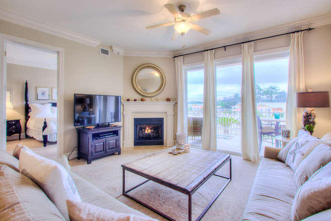 1653 West County Highway 30A, Unit 1116 Santa Rosa Beach, FL 32459 - Photo 11 of 41 a living room with furniture a fireplace and a large window