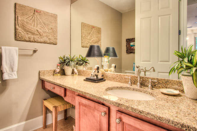 1653 West County Highway 30A, Unit 1116 Santa Rosa Beach, FL 32459 - Photo 13 of 41 a bathroom with a granite countertop sink and a mirror