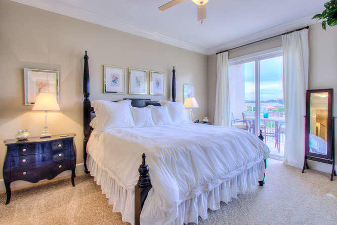 1653 West County Highway 30A, Unit 1116 Santa Rosa Beach, FL 32459 - Photo 15 of 41 a bedroom with a bed and a lamp on dresser