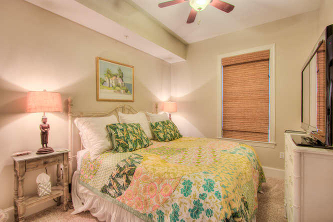1653 West County Highway 30A, Unit 1116 Santa Rosa Beach, FL 32459 - Photo 17 of 41 a bedroom with a bed and a chandelier