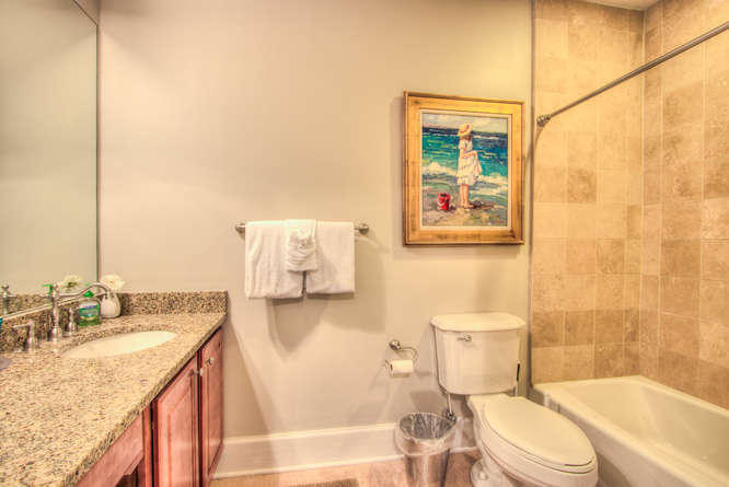 1653 West County Highway 30A, Unit 1116 Santa Rosa Beach, FL 32459 - Photo 19 of 41 a bathroom with a granite countertop sink toilet and shower