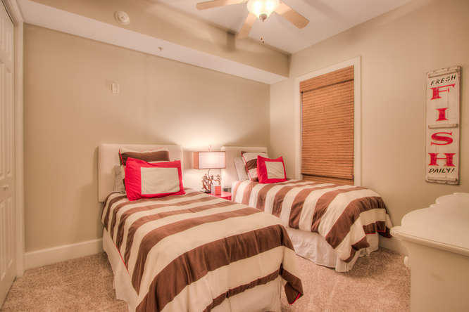 1653 West County Highway 30A, Unit 1116 Santa Rosa Beach, FL 32459 - Photo 20 of 41 a bedroom with two beds and a dresser next to a window