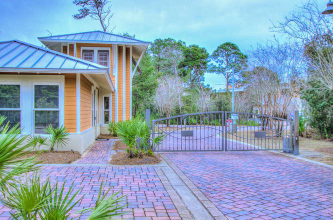 1653 West County Highway 30A, Unit 1116 Santa Rosa Beach, FL 32459 - Photo 2 of 41 a front view of a house with a garden