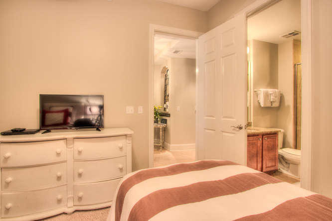 1653 West County Highway 30A, Unit 1116 Santa Rosa Beach, FL 32459 - Photo 21 of 41 a bedroom with a bed and a flat screen tv