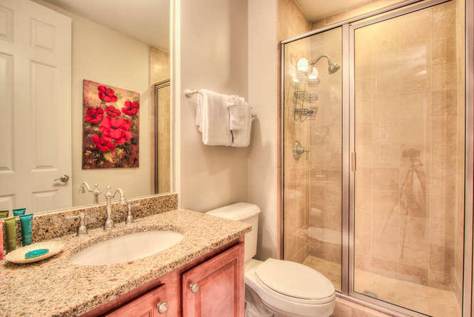 1653 West County Highway 30A, Unit 1116 Santa Rosa Beach, FL 32459 - Photo 22 of 41 a bathroom with a granite countertop sink toilet and shower