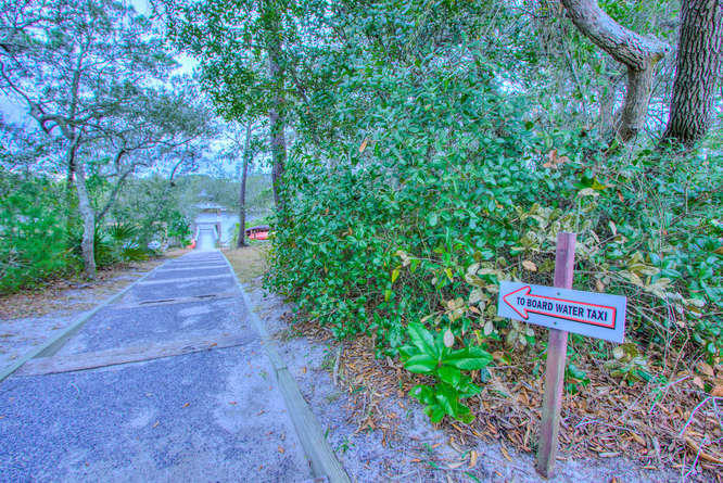 1653 West County Highway 30A, Unit 1116 Santa Rosa Beach, FL 32459 - Photo 33 of 41 a view of a street with potted plants and trees