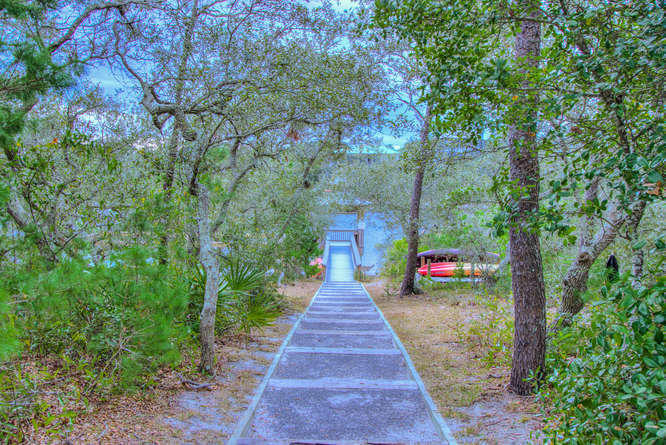 1653 West County Highway 30A, Unit 1116 Santa Rosa Beach, FL 32459 - Photo 34 of 41 a view of a pathway with a house in the background