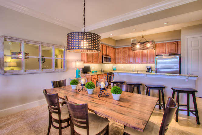 1653 West County Highway 30A, Unit 1116 Santa Rosa Beach, FL 32459 - Photo 8 of 41 a dining room with furniture a chandelier and window