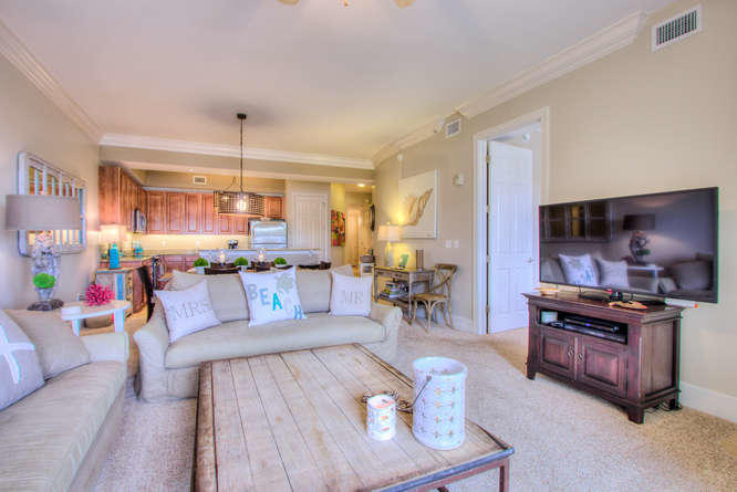 1653 West County Highway 30A, Unit 1116 Santa Rosa Beach, FL 32459 - Photo 10 of 41 a living room with furniture kitchen view and a wooden floor