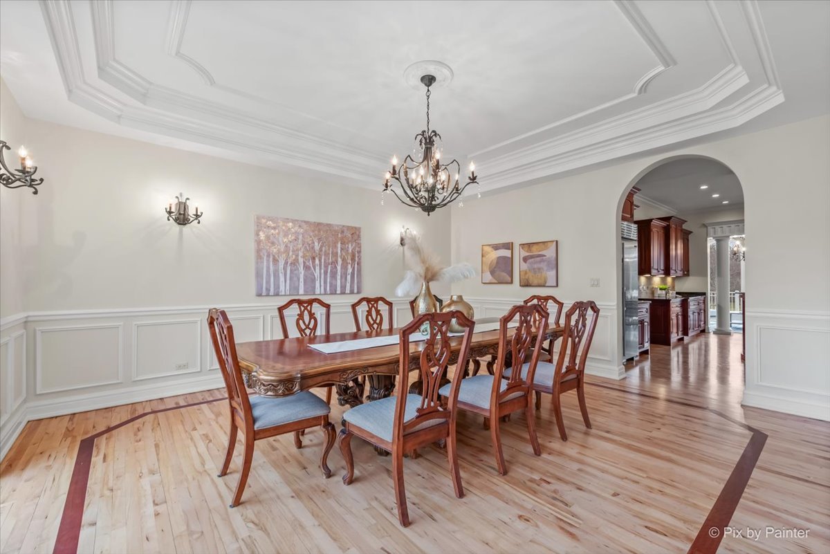 27 West Onwentsia Road Lake Forest, IL 60045 - Photo 12 of 73 a view of a dining room with furniture wooden floor and chandelier