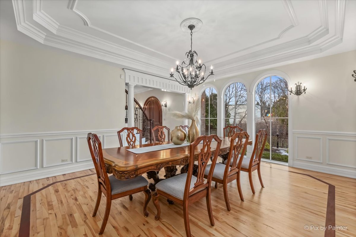 27 West Onwentsia Road Lake Forest, IL 60045 - Photo 14 of 73 a view of a dining room with furniture a chandelier and wooden floor