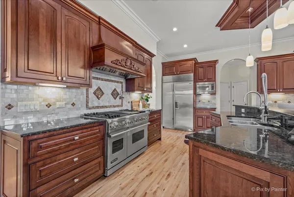 a living room with lots of furniture and wooden floor