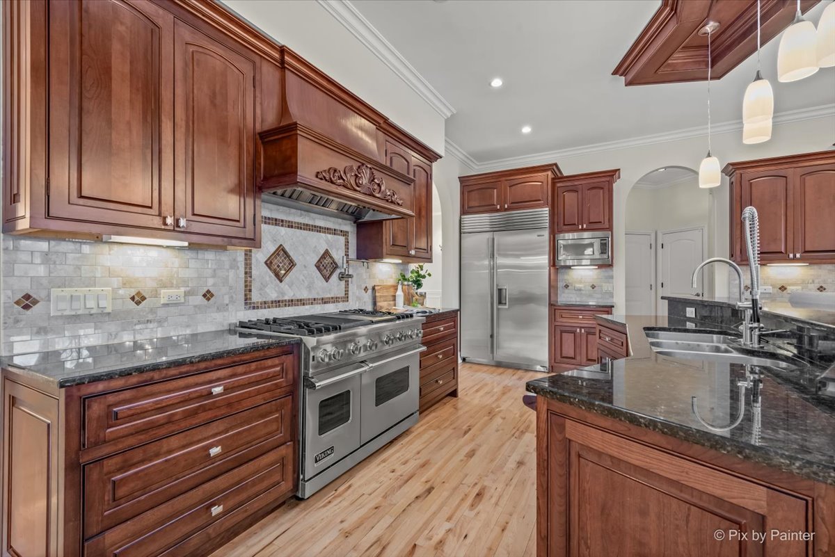 27 West Onwentsia Road Lake Forest, IL 60045 - Photo 20 of 73 a kitchen with stainless steel appliances granite countertop a stove and a sink