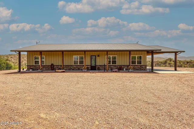 a front view of building with yard