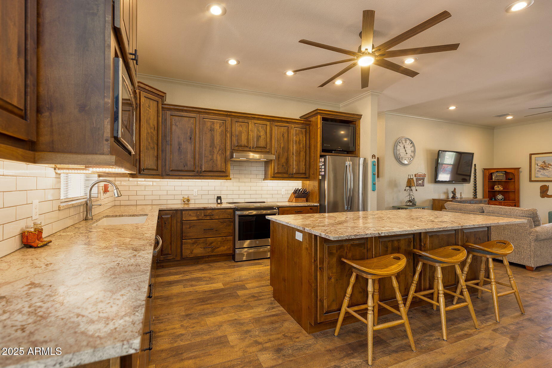 828 North Gun Creek Road Payson, AZ 85541 - Photo 17 of 57 a kitchen with stainless steel appliances granite countertop a sink and a refrigerator
