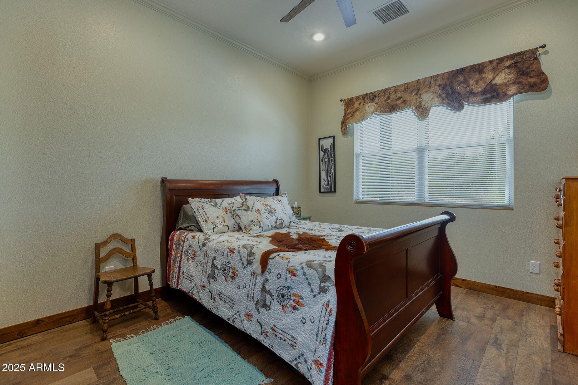 828 North Gun Creek Road Payson, AZ 85541 - Photo 28 of 57 a bed sitting in a bedroom next to a window