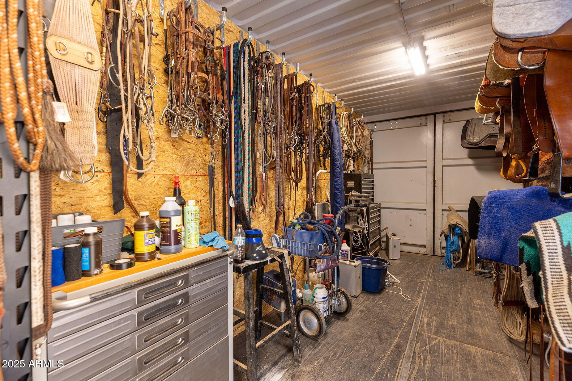 828 North Gun Creek Road Payson, AZ 85541 - Photo 49 of 57 a view of walk in closet with clothes and shoes