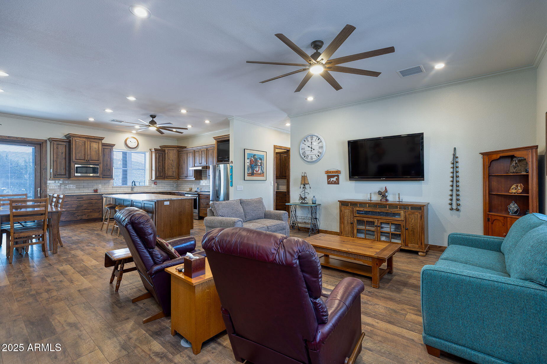828 North Gun Creek Road Payson, AZ 85541 - Photo 10 of 57 a living room with furniture a flat screen tv and kitchen view