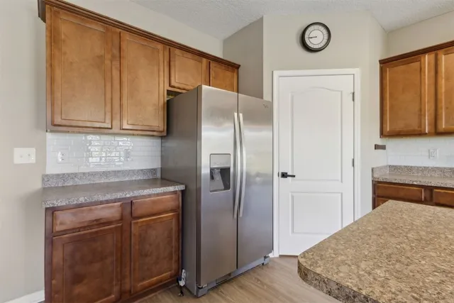 a kitchen with a stove microwave and sink