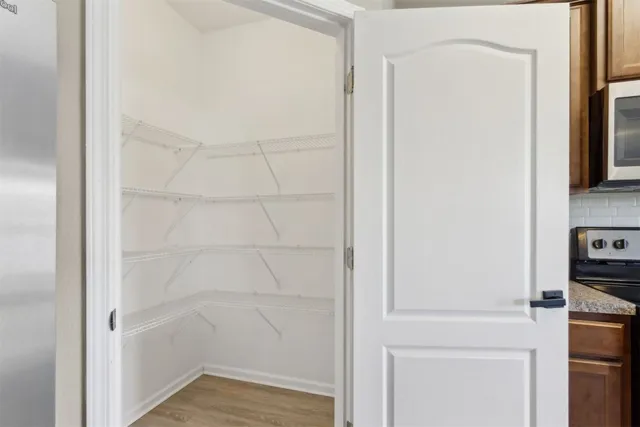 a bathroom with a sink toilet vanity and shower