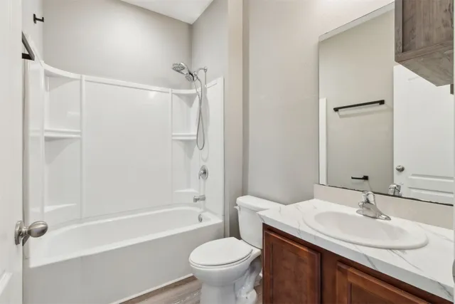 a view of an entryway with wooden floor