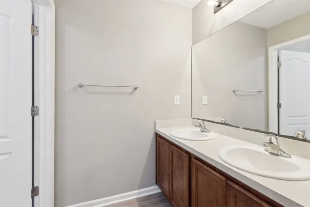 a white toilet sitting next to a bath tub