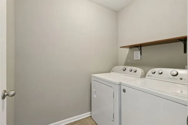 a view of a room with gym equipment and a window