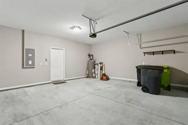 a view of a backyard with plants and a garden