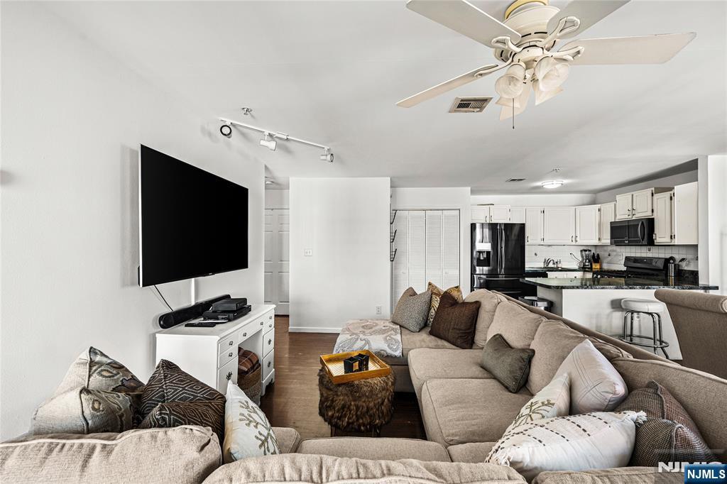 84 Union Street Newark, NJ 07105 - Photo 24 of 39 a living room with furniture and a flat screen tv