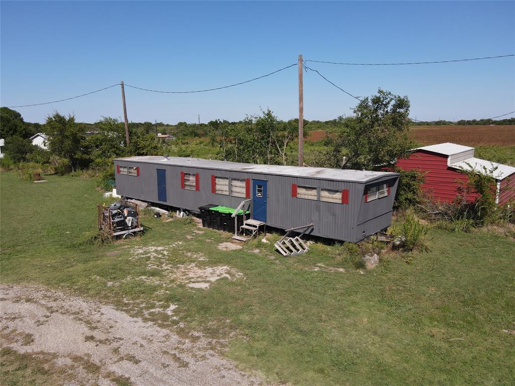 16531 Farm To Market 455 Pilot Point, TX 76258 - Photo 9 of 37 Manufactured / mobile home with a front yard