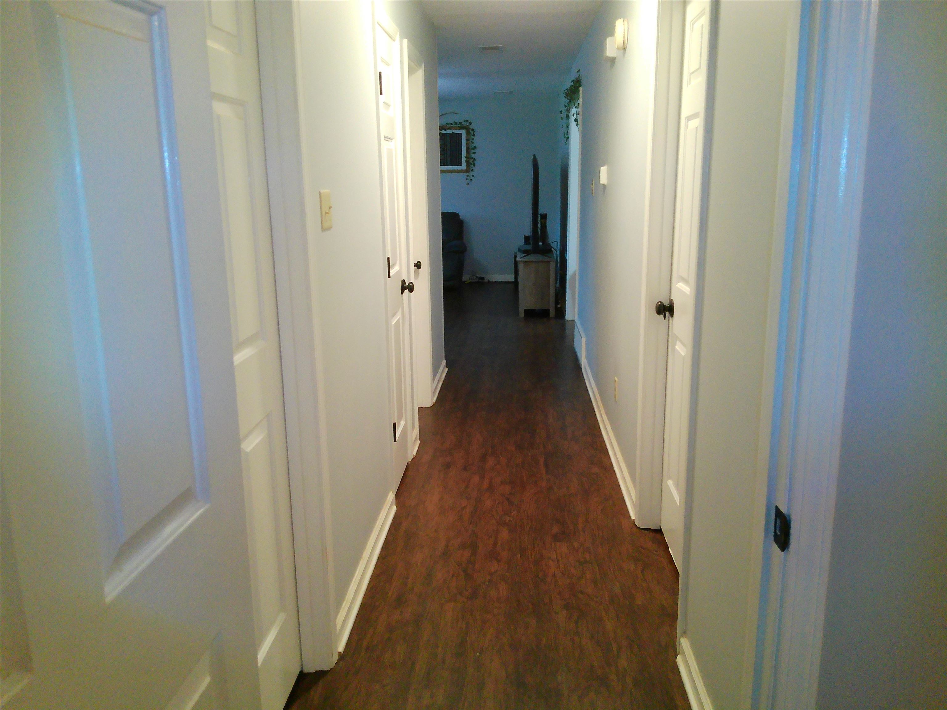 336 Pwr Loop Munford, TN 38058 - Photo 15 of 24 Hallway featuring dark wood-type flooring