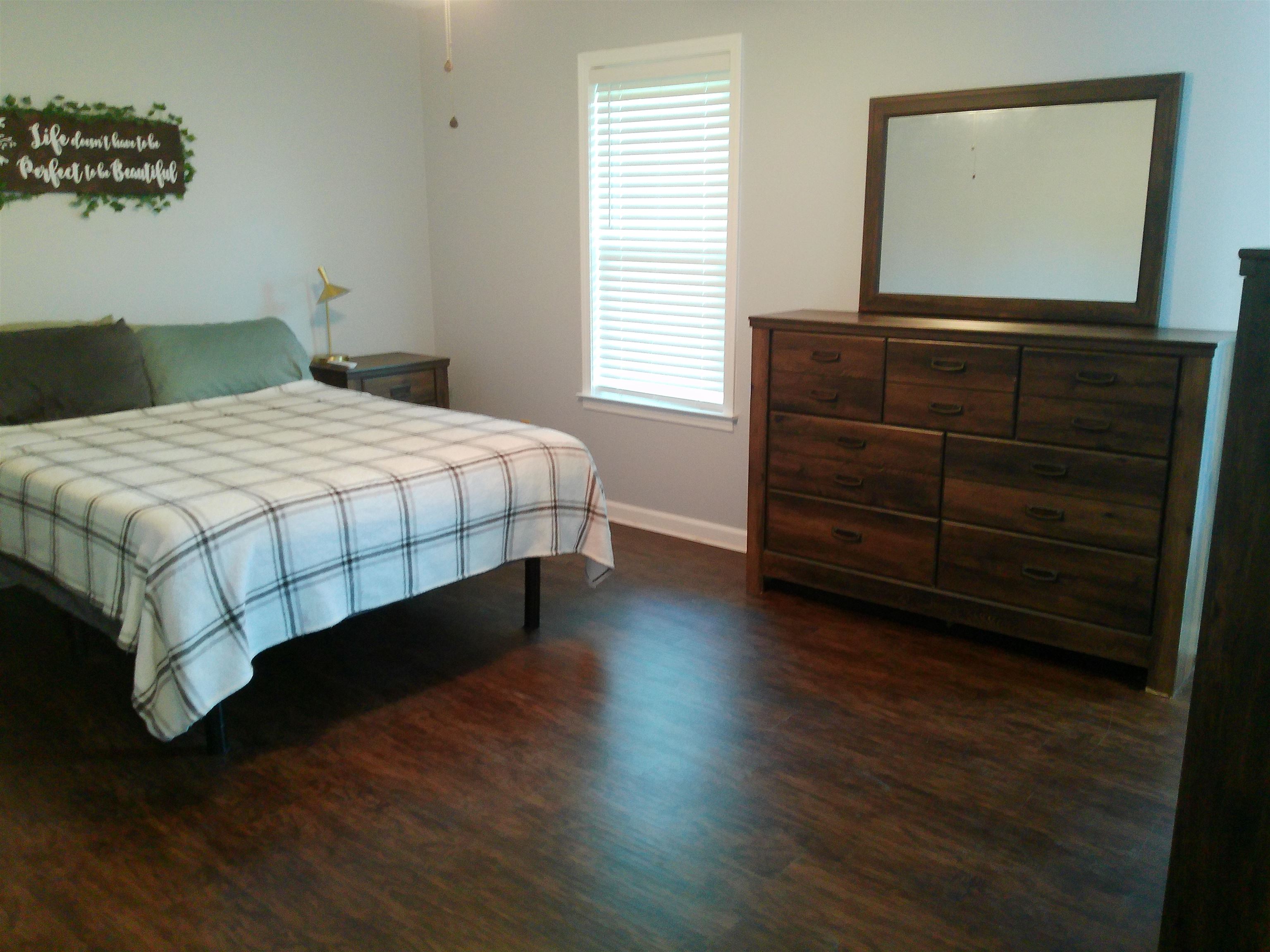 336 Pwr Loop Munford, TN 38058 - Photo 16 of 24 Bedroom featuring dark hardwood / wood-style floors