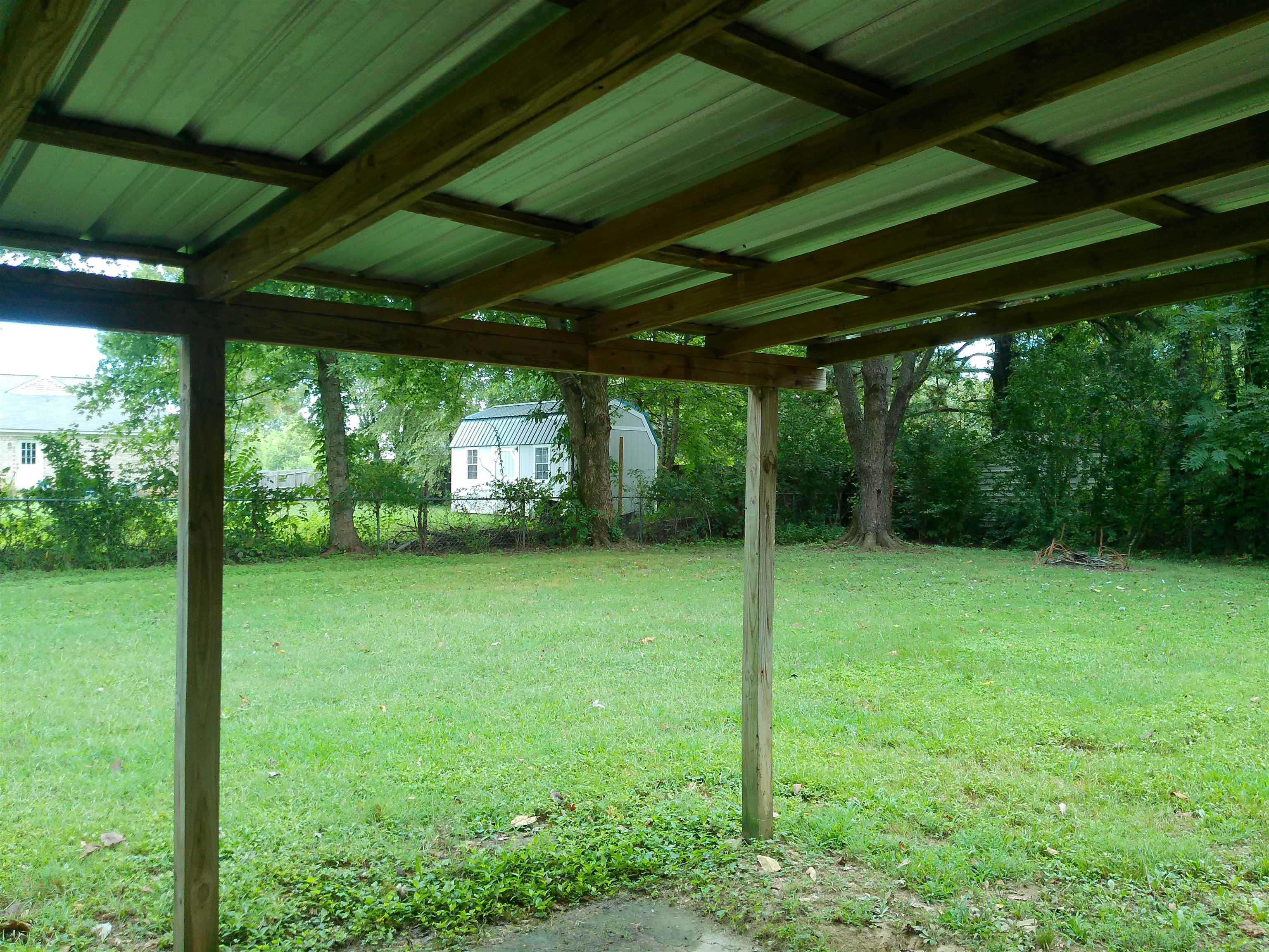 336 Pwr Loop Munford, TN 38058 - Photo 22 of 24 View of yard featuring a storage unit