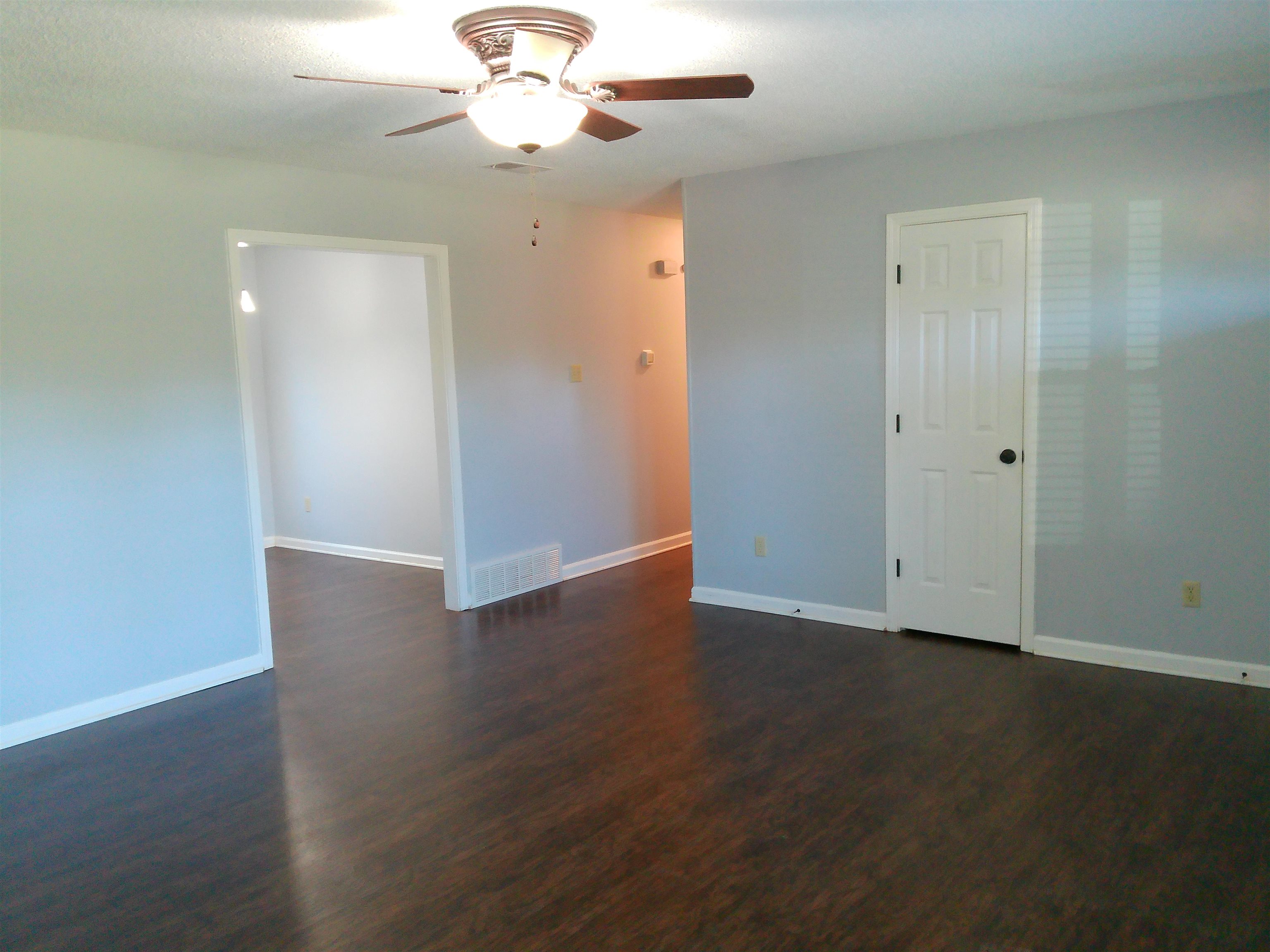 336 Pwr Loop Munford, TN 38058 - Photo 24 of 24 Empty room featuring ceiling fan and dark wood-type flooring